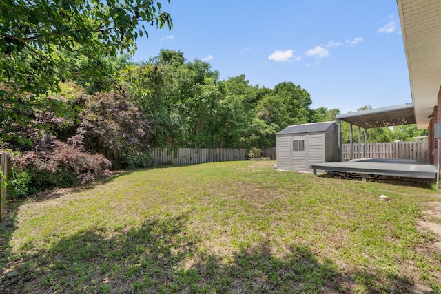view of yard featuring a storage shed and an outbuilding