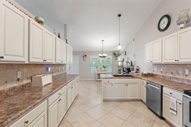 kitchen with stainless steel dishwasher, a sink, a peninsula, a chandelier, and decorative backsplash