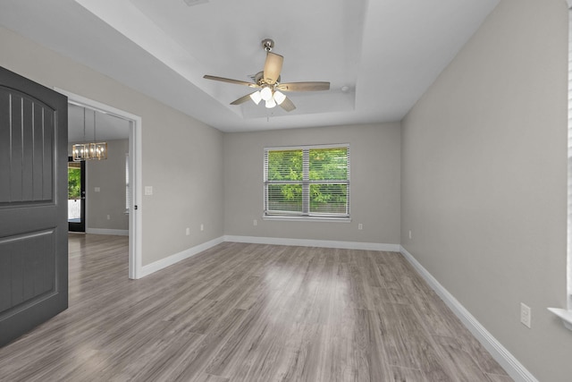 2354 Barberee Dr, Crestview, FL 32536 - spare room with healthy amount of natural light, a raised ceiling, and wood finished floors