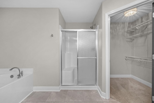 2354 Barberee Dr, Crestview, FL 32536 - bathroom with a shower stall, baseboards, a garden tub, and tile patterned floors