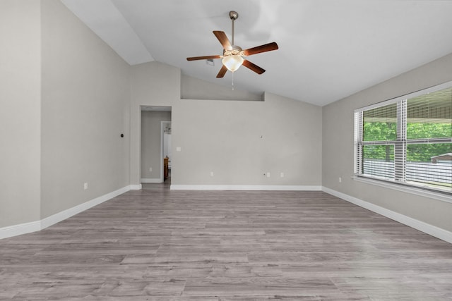2354 Barberee Dr, Crestview, FL 32536 - empty room with ceiling fan, lofted ceiling, wood finished floors, and baseboards