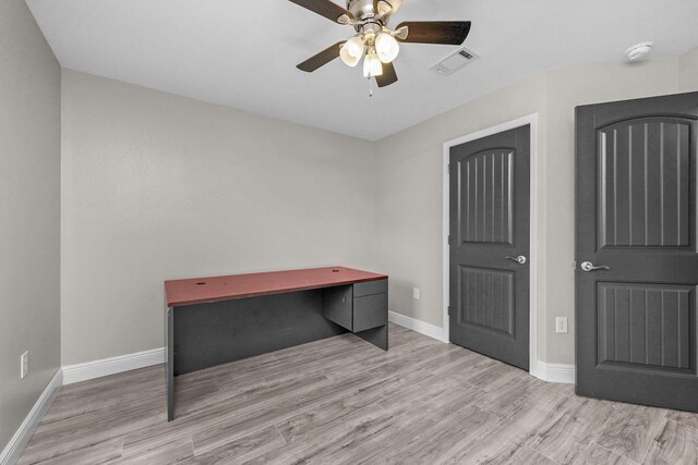 2354 Barberee Dr, Crestview, FL 32536 - unfurnished office featuring ceiling fan, wood finished floors, and baseboards