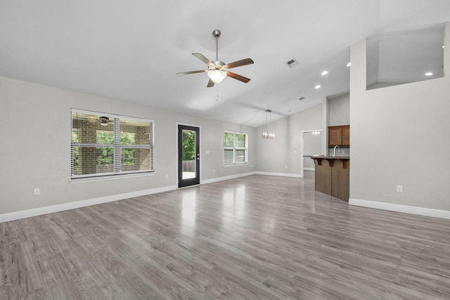 2354 Barberee Dr, Crestview, FL 32536 - unfurnished living room featuring ceiling fan, a chandelier, baseboards, wood finished floors, and recessed lighting