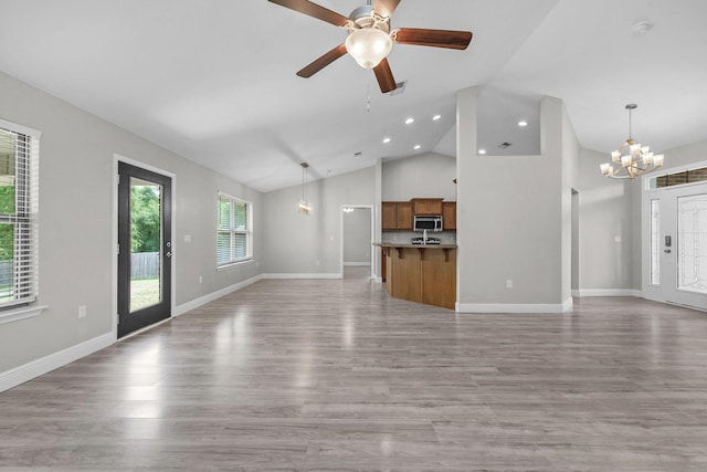2354 Barberee Dr, Crestview, FL 32536 - unfurnished living room with a chandelier, light wood finished floors, a ceiling fan, baseboards, and recessed lighting