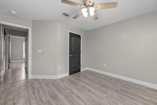 2354 Barberee Dr, Crestview, FL 32536 - unfurnished room featuring light wood finished floors, baseboards, ceiling fan, and a smoke detector