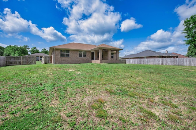 2354 Barberee Dr, Crestview, FL 32536 - rear view of property featuring brick siding and a gate