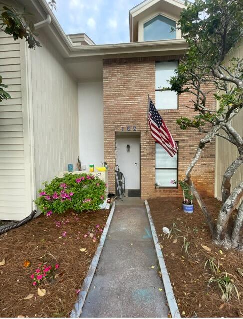 3861 Indian Trl Unit 102, Destin, FL 32541 - doorway to property with brick siding