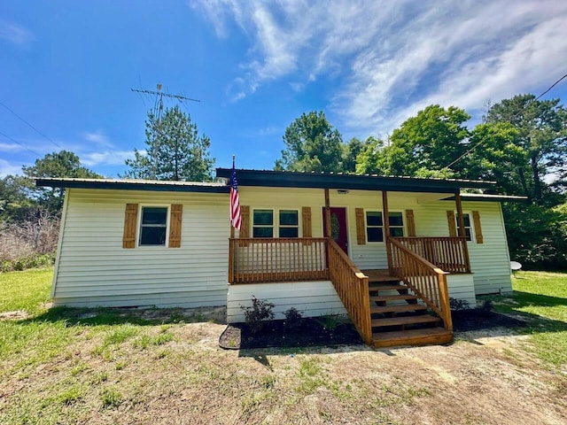 86 Poston Rd, Defuniak Springs, FL 32433 - manufactured / mobile home featuring covered porch and stairs
