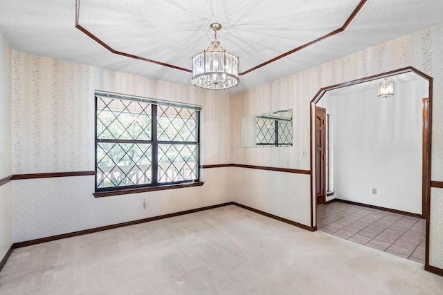 102 Bermuda Way, Niceville, FL 32578 - carpeted spare room with wallpapered walls, a chandelier, and baseboards