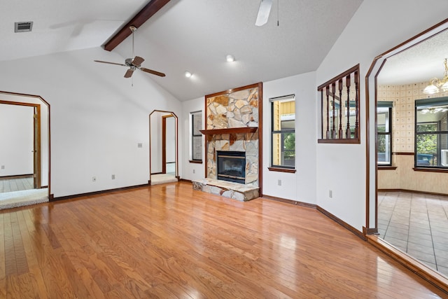 102 Bermuda Way, Niceville, FL 32578 - unfurnished living room with ceiling fan, light wood-style flooring, a stone fireplace, and baseboards