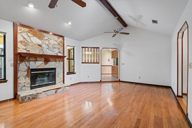 102 Bermuda Way, Niceville, FL 32578 - unfurnished living room featuring ceiling fan, wood finished floors, a fireplace, and baseboards