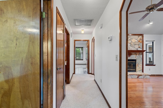 102 Bermuda Way, Niceville, FL 32578 - corridor featuring a textured ceiling and baseboards