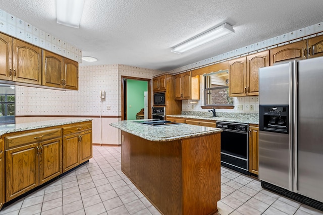 102 Bermuda Way, Niceville, FL 32578 - kitchen featuring stainless steel fridge, wallpapered walls, dishwasher, built in microwave, and a textured ceiling