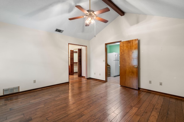 102 Bermuda Way, Niceville, FL 32578 - unfurnished bedroom featuring freestanding refrigerator, beamed ceiling, baseboards, wood-type flooring, and high vaulted ceiling