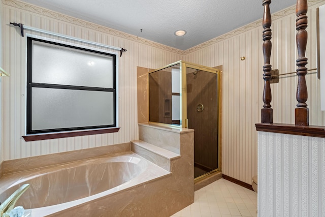 102 Bermuda Way, Niceville, FL 32578 - bathroom with wallpapered walls, tile patterned flooring, a shower stall, a garden tub, and a textured ceiling