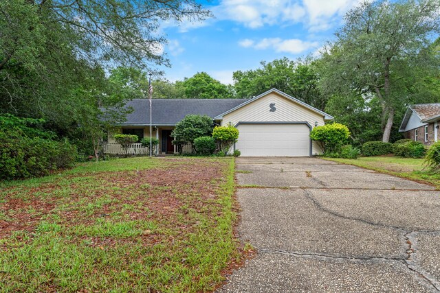 102 Bermuda Way, Niceville, FL 32578 - ranch-style house with a garage and asphalt driveway