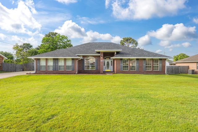 6562 Bellingham St, Navarre, FL 32566 - ranch-style home with brick siding, cooling unit, and roof with shingles