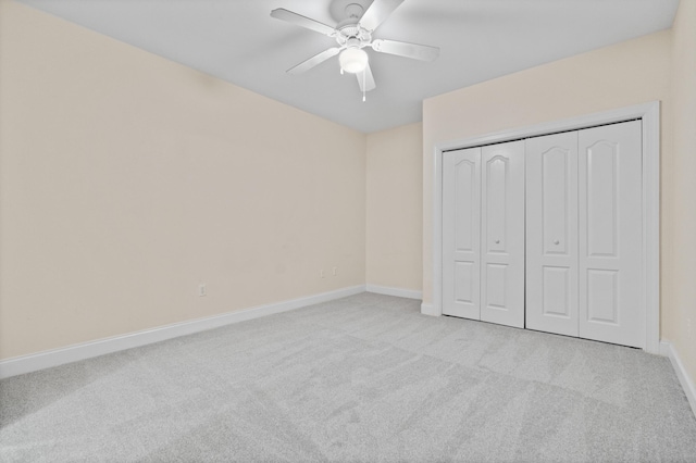 251 Mattie M Kelly Blvd Unit 203, Destin, FL 32541 - unfurnished bedroom with carpet floors, baseboards, a closet, and a ceiling fan