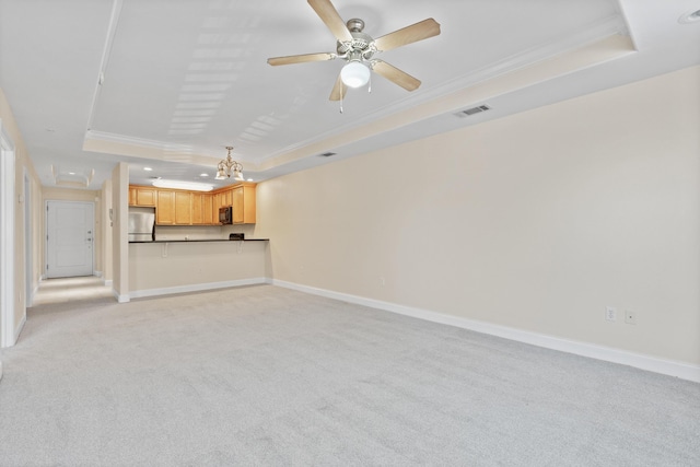 251 Mattie M Kelly Blvd Unit 203, Destin, FL 32541 - unfurnished living room with a raised ceiling, ornamental molding, light colored carpet, baseboards, and a ceiling fan