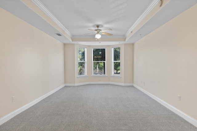 251 Mattie M Kelly Blvd Unit 203, Destin, FL 32541 - carpeted spare room with a raised ceiling, crown molding, a ceiling fan, and baseboards