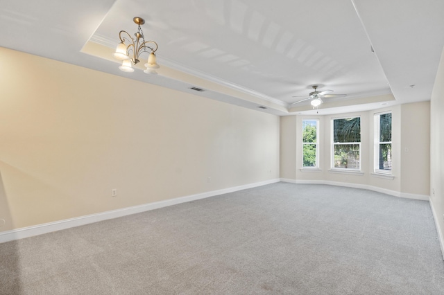 251 Mattie M Kelly Blvd Unit 203, Destin, FL 32541 - unfurnished room with a tray ceiling, carpet, a chandelier, crown molding, and baseboards