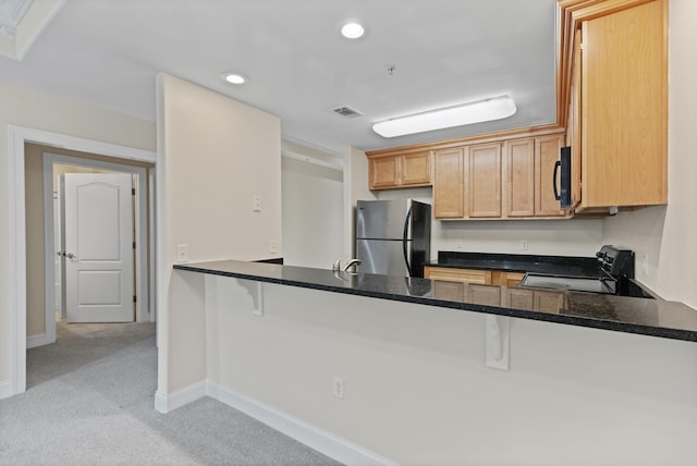251 Mattie M Kelly Blvd Unit 203, Destin, FL 32541 - kitchen featuring black appliances, a peninsula, recessed lighting, light carpet, and baseboards