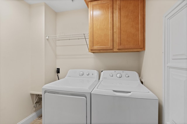 251 Mattie M Kelly Blvd Unit 203, Destin, FL 32541 - laundry area with cabinet space, washer and dryer, and baseboards