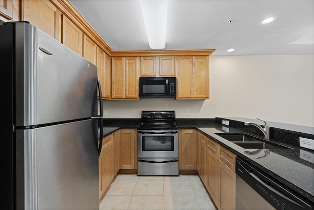 251 Mattie M Kelly Blvd Unit 203, Destin, FL 32541 - kitchen with stainless steel appliances, a sink, light tile patterned flooring, dark stone counters, and recessed lighting