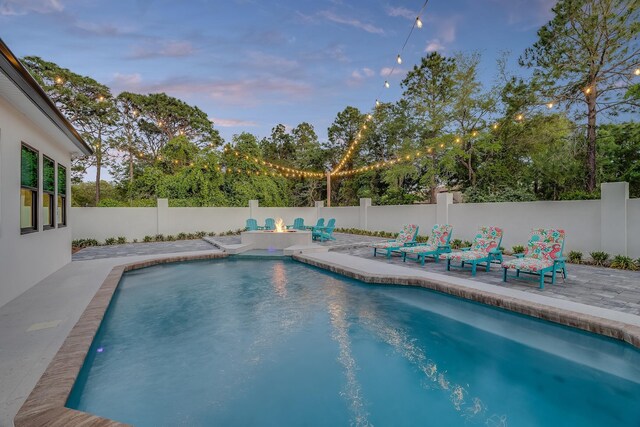 view of swimming pool featuring a patio area and a fenced backyard