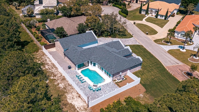 aerial view of residential area featuring a pool