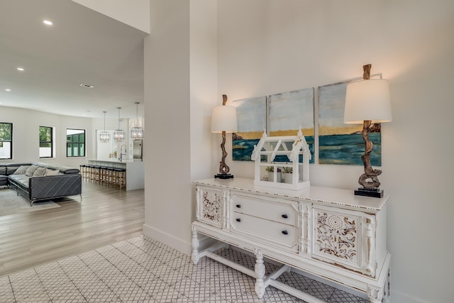 corridor featuring recessed lighting and baseboards