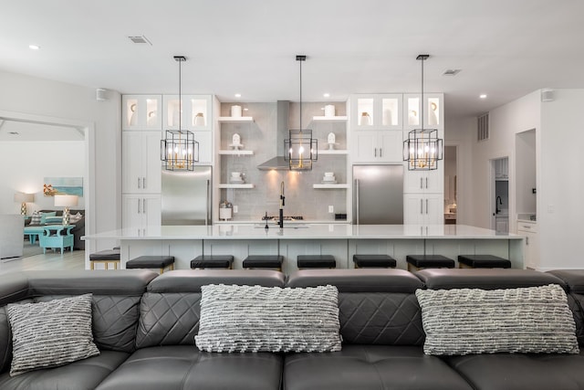 living area with a chandelier and recessed lighting
