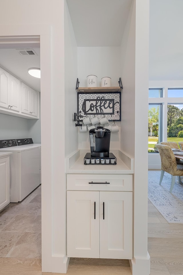 bar featuring separate washer and dryer