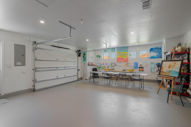 garage featuring electric panel, recessed lighting, and baseboards