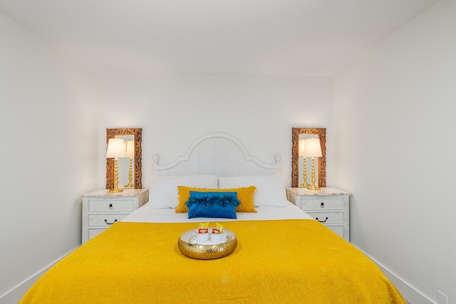 bedroom featuring baseboards