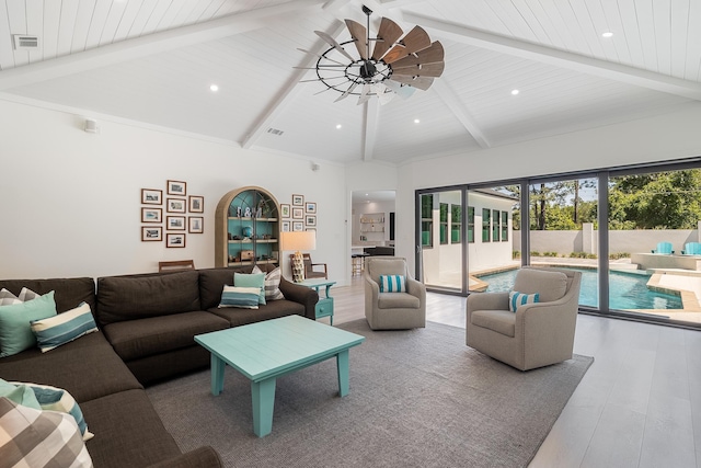 living area featuring beam ceiling, high vaulted ceiling, and recessed lighting