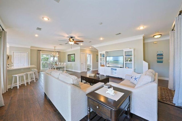 living area featuring ceiling fan, baseboards, ornamental molding, dark wood-type flooring, and recessed lighting