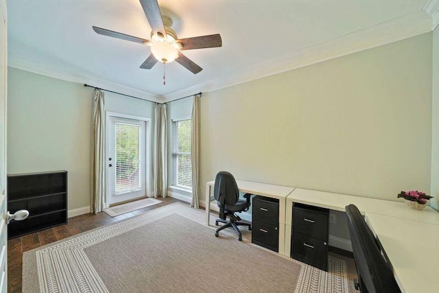 office featuring a ceiling fan, wood finished floors, crown molding, and baseboards