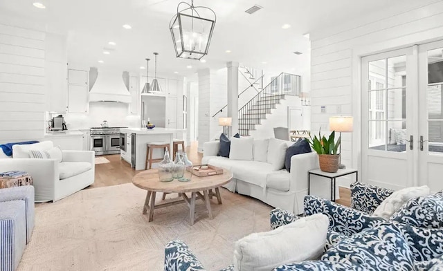 17 Compass Point Way, Watersound, FL 32461 - living room featuring stairs and light wood-style floors