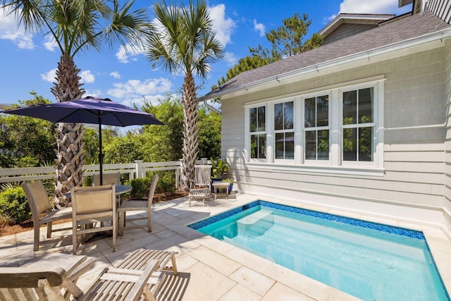 17 Compass Point Way, Watersound, FL 32461 - swimming pool featuring a patio area, outdoor dining space, and fence