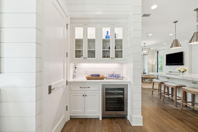 17 Compass Point Way, Watersound, FL 32461 - indoor dry bar featuring beverage cooler, wood finished floors, recessed lighting, and decorative light fixtures