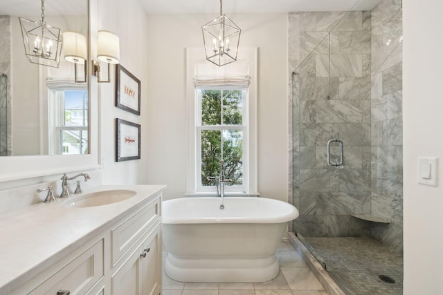 17 Compass Point Way, Watersound, FL 32461 - bathroom featuring a chandelier, a stall shower, a soaking tub, and vanity