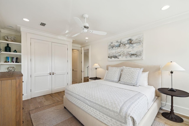 17 Compass Point Way, Watersound, FL 32461 - bedroom featuring ornamental molding, a closet, wood finished floors, recessed lighting, and a ceiling fan