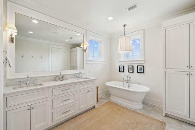 17 Compass Point Way, Watersound, FL 32461 - full bath with ornamental molding, baseboards, a freestanding tub, marble look tile flooring, and recessed lighting