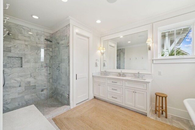 17 Compass Point Way, Watersound, FL 32461 - full bath featuring crown molding, a stall shower, recessed lighting, baseboards, and double vanity