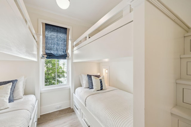 17 Compass Point Way, Watersound, FL 32461 - bedroom with light wood-type flooring and baseboards