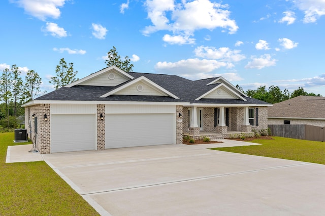 craftsman inspired home with brick siding, central AC, an attached garage, and driveway