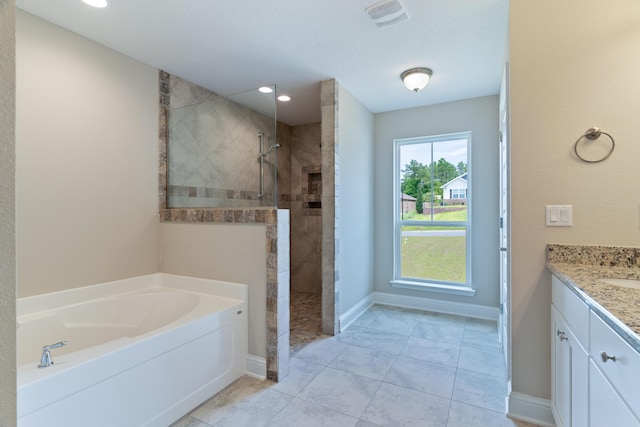 bathroom featuring walk in shower, a garden tub, vanity, baseboards, and recessed lighting