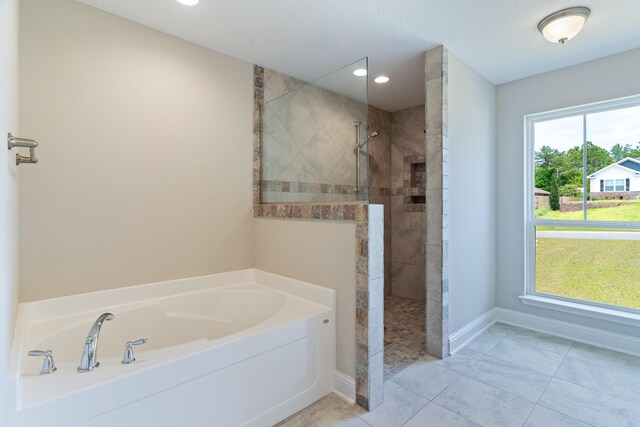 full bath featuring a garden tub, walk in shower, recessed lighting, and baseboards