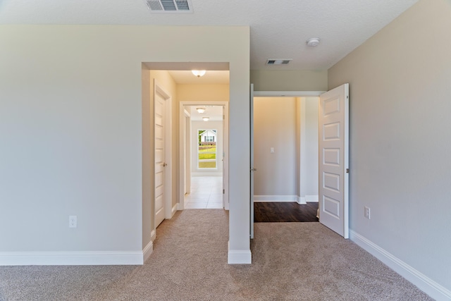 unfurnished bedroom featuring carpet flooring and baseboards